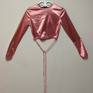 Pink long sleeve with ties, cropped. Size medium in womens, from Urban Planet